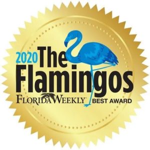 A gold seal featuring a blue flamingo and the text 2020 The Flamingos Florida Weekly Best Award.